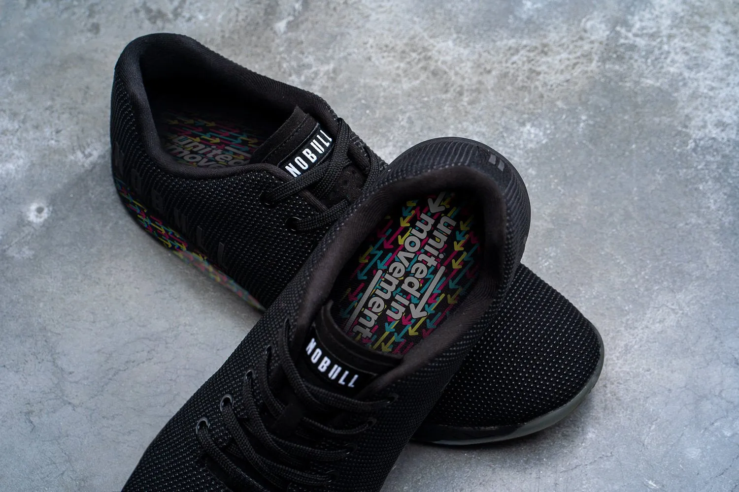 UNITED IN MOVEMENT BLACK TRAINER